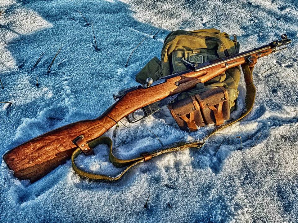 The Mosin Nagant is a popular military surplus rifle.  Surplus ammo is readily available as well. 